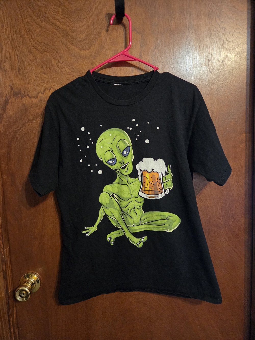 Black T-Shirt with Green Alien Graphic